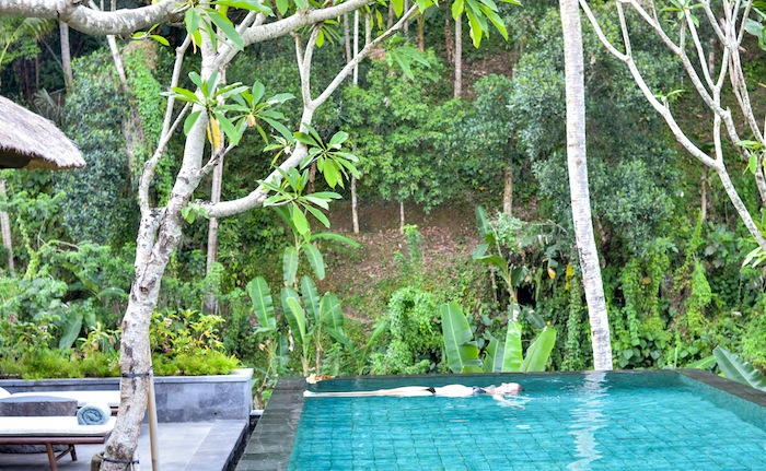 floating in the villa pool at ritz carlton mandapa ubud
