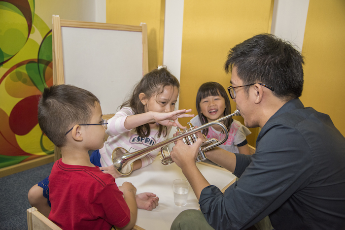 children learning about the trumpet at aureus academy music camp