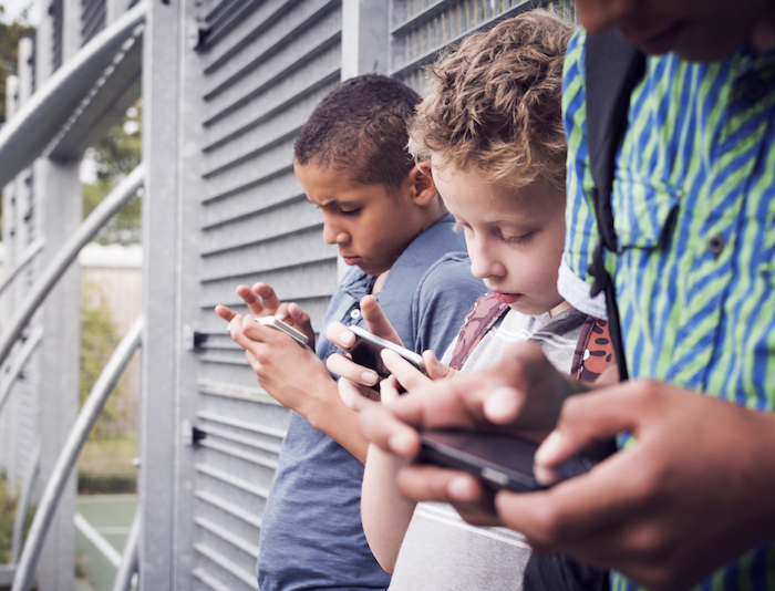 Kids playing on cell phones