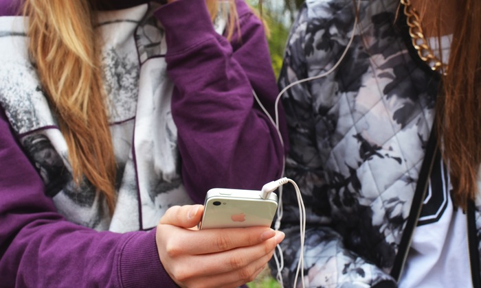 Kids listening to music on a phone