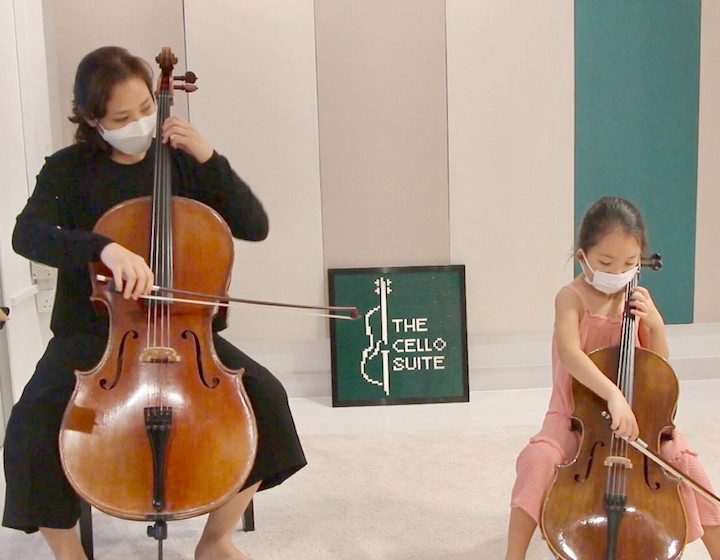 Music Schools in Singapore - The Cello Suite - child and teacher with cellos