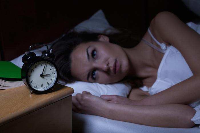 jet-lag-imi-scoop-woman-sleep-alarm-clock