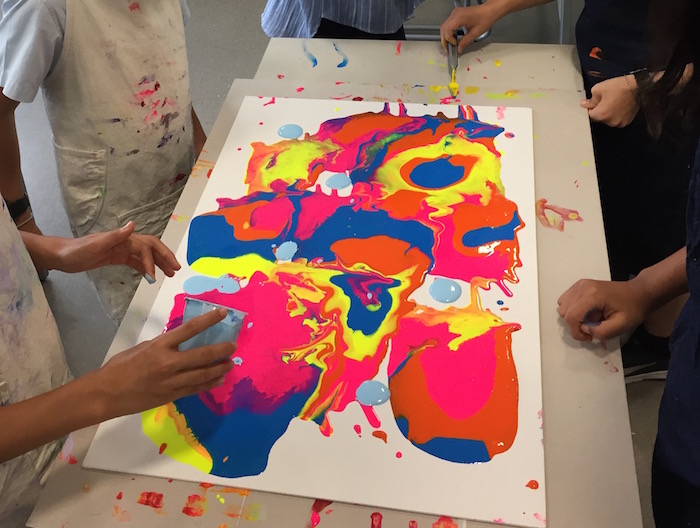 paint pouring during Arts Week at GEMS World Academy Singapore