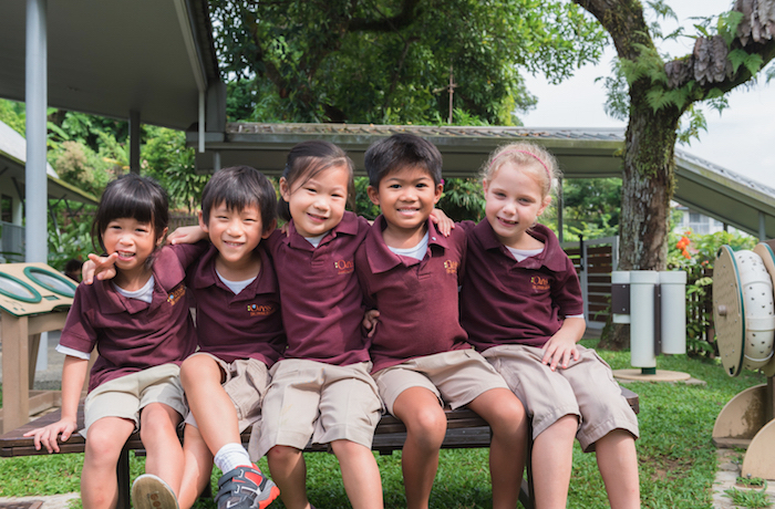 Children outside in a playground at Odyssey, The Global Preschool