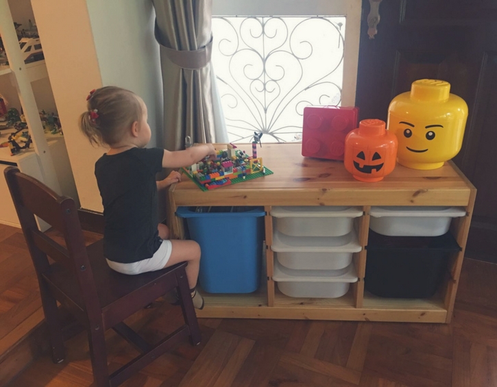 Kid playing with Lego at home
