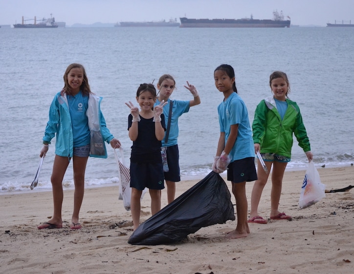 green schools in singapore nexus international school students doing beach clean up