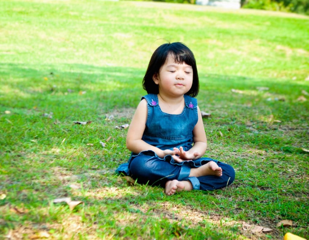 teach kids mindfulness meditating calmness