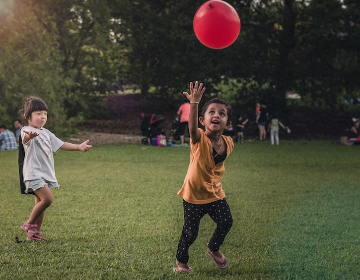 parents pay attention environment kids playing park balloon