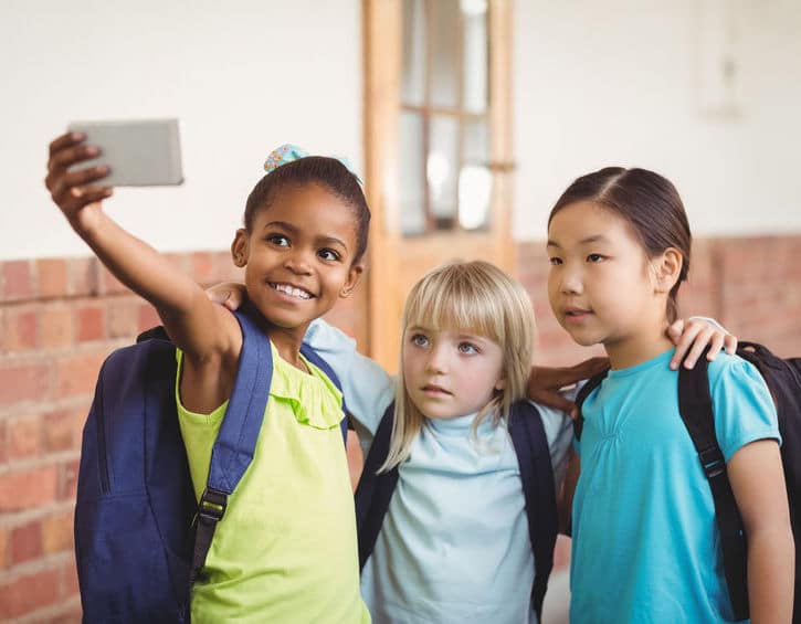 kids taking selfie