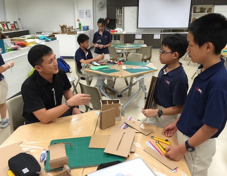 pang hoke wei of 3m singapore with kids at the sst-3m innoscience challenge