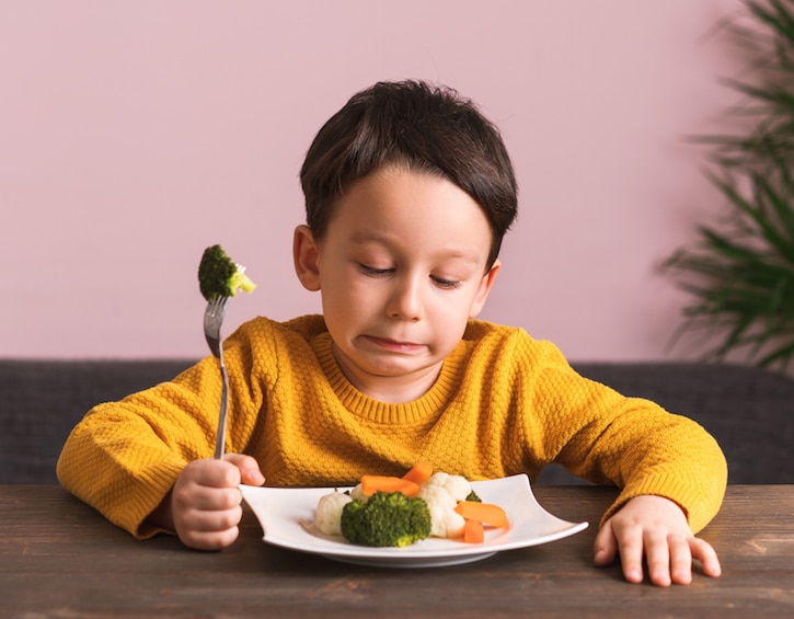 Child is very unhappy with having to eat vegetables.