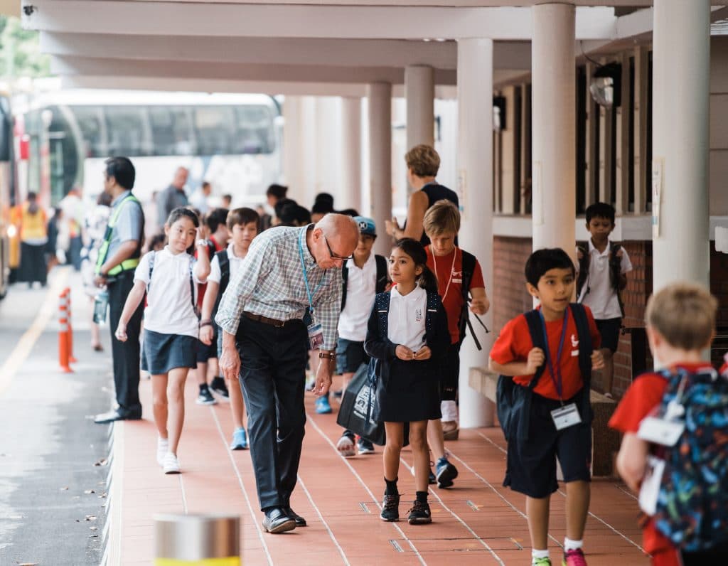 counseling at singapore american school a teacher walks with a student