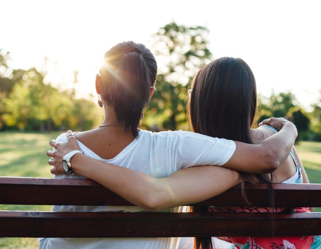 Mom and daughter embracing