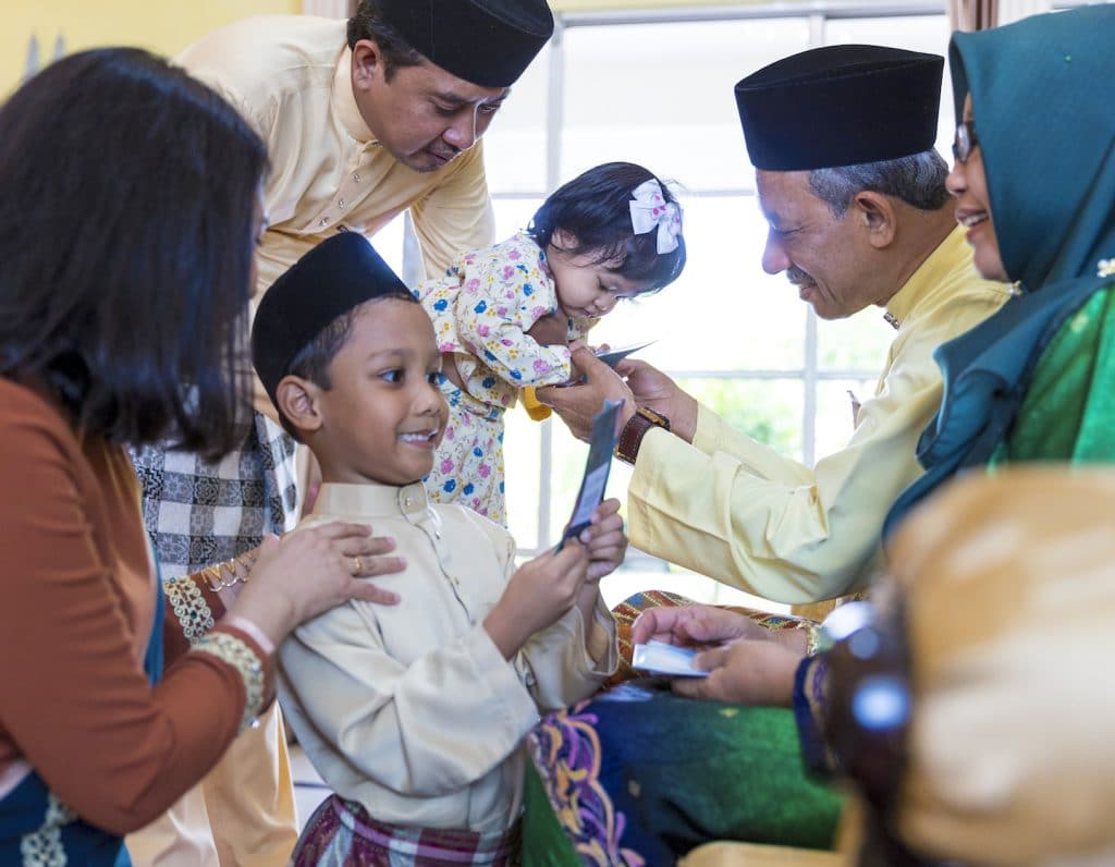 Grandchildren receiving Eid gifts from Grandparents