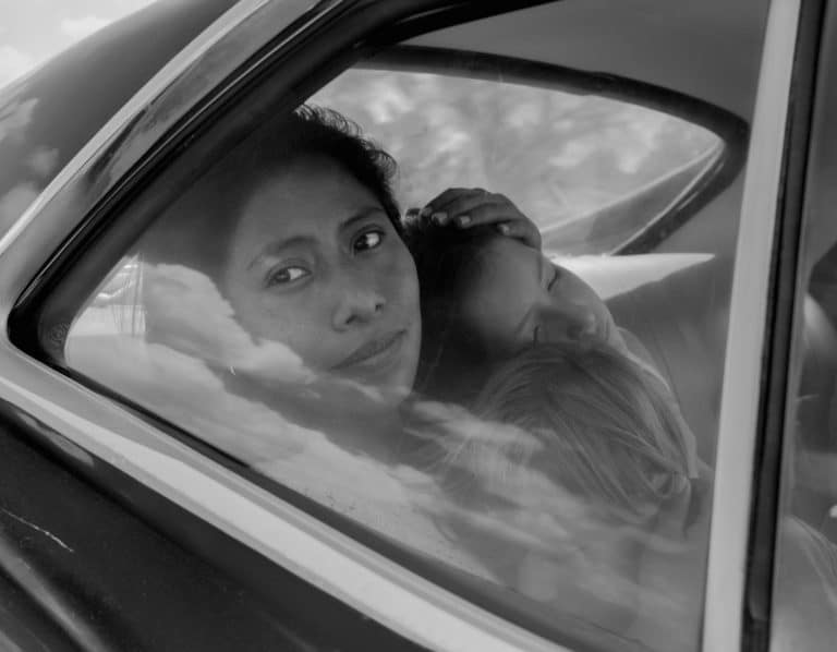 Cleo, the star of ROMA, with children in the car