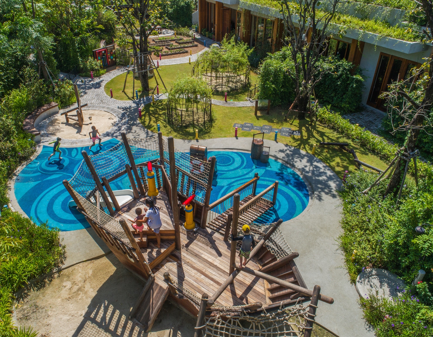 aerial shot of the amazing rosewood phuket kids club in thailand