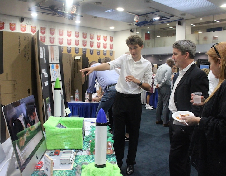 a student presenting his IB DP final project at stamford american international school