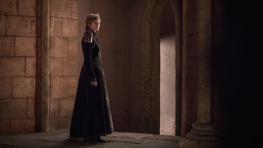 Queen Cersei Lannister stands alone in the Red Keep in Game of Thrones season 8