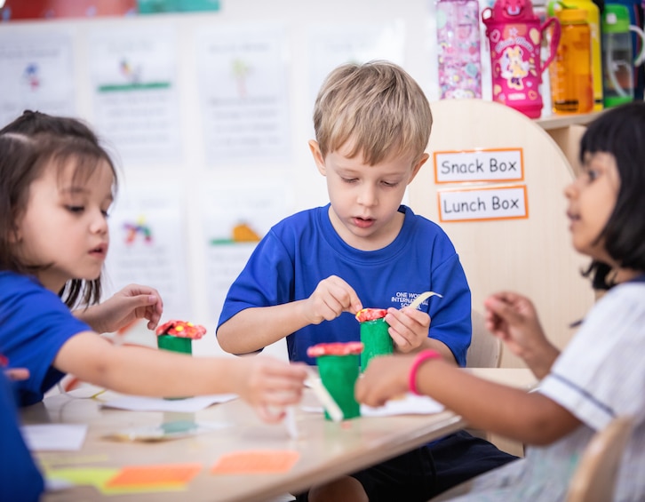 Primary students working on an art project at one world international school (OWIS)