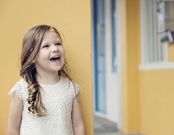 a little girl in joo chiat singapore during an outdoor family photoshoot by littleones photography