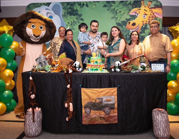 Family photos at a momentous safari-themed first birthday party