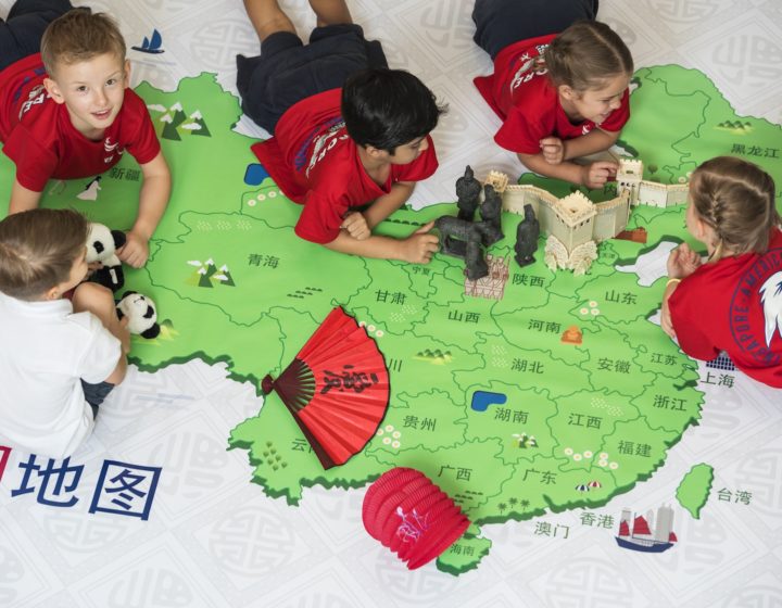 kids on a map of china in the sas chinese immersion kindergarten