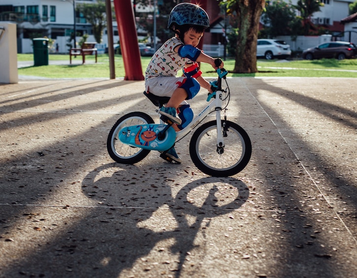 child riding a bicycle tips from family photographer kerry cheah