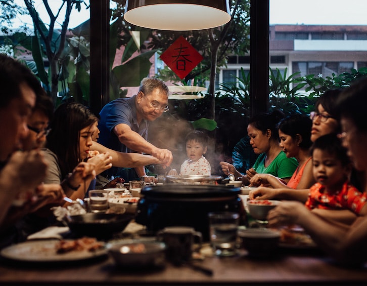 a family dines together at a hotpot dinner