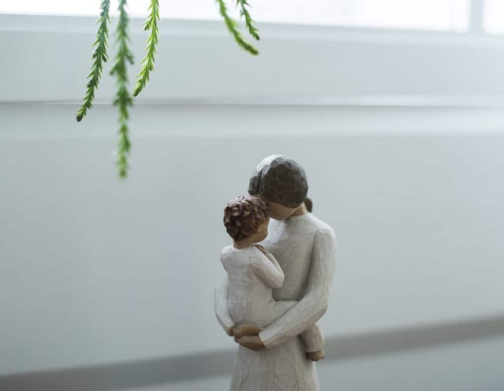 mother-baby-hug-figurine