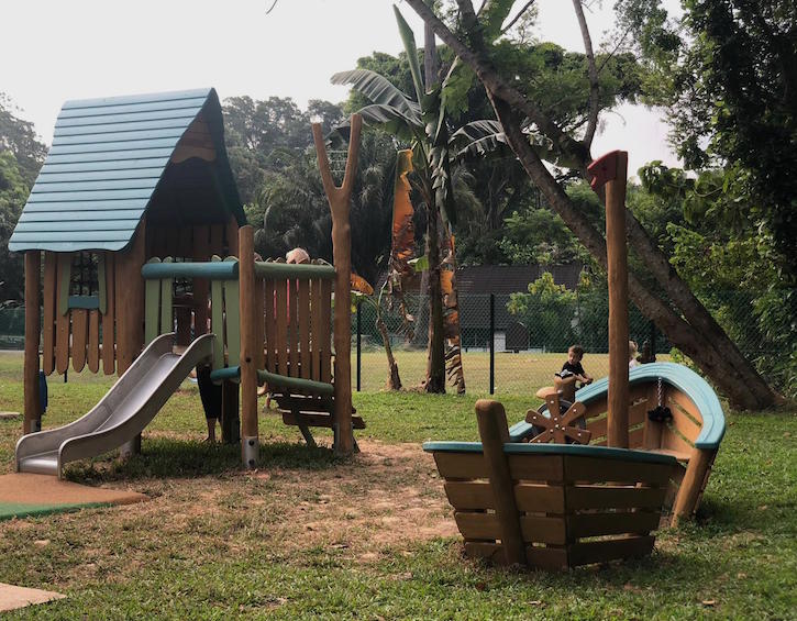 a treehouse slide and ship are great for imaginative play on the new dempsey playground at baker & cook