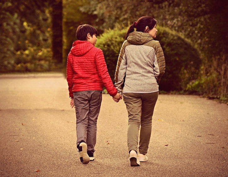 teen communication mother son walking