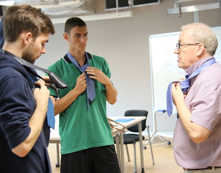 gess students learn how to tie a tie as an essential life skill