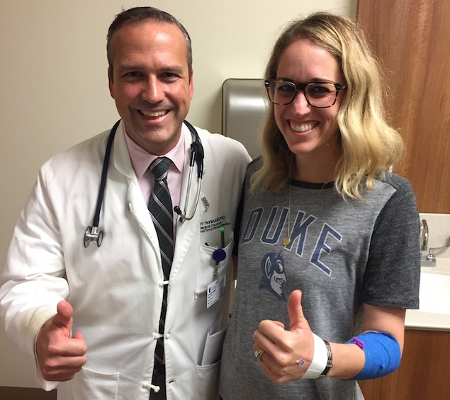 wife has cancer melinda with doctor at duke cancer institute thumbs up