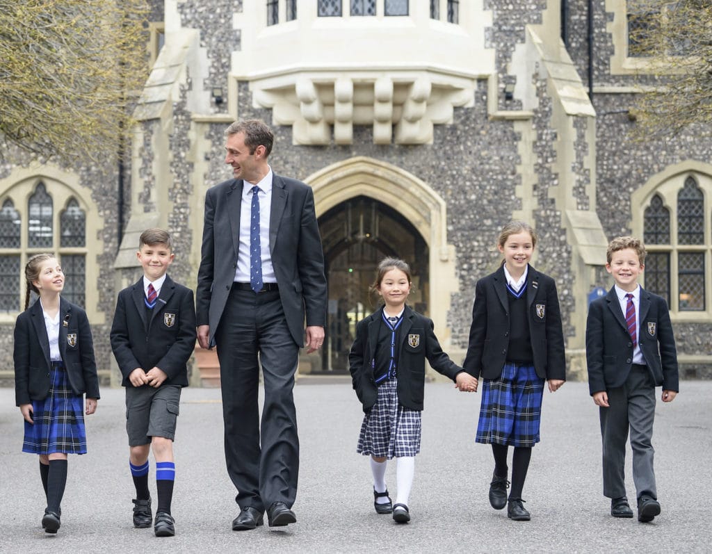 brighton college singapore head master Paul Wilson walks with students at Brighton College UK