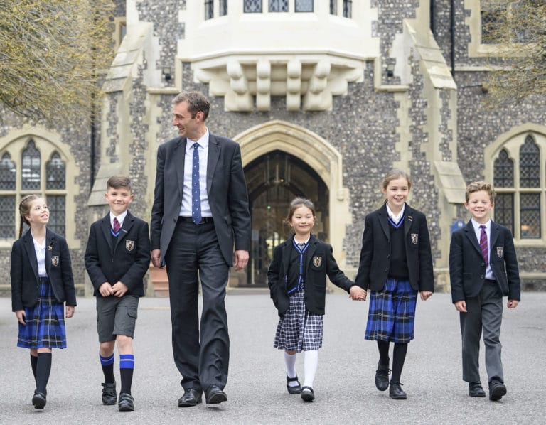 brighton college singapore head master Paul Wilson walks with students at Brighton College UK