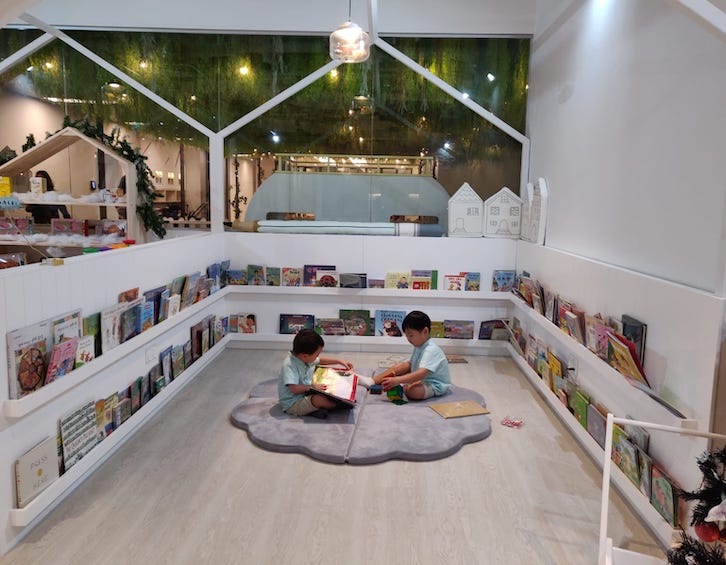 children reading at singapore preschool trehaus school