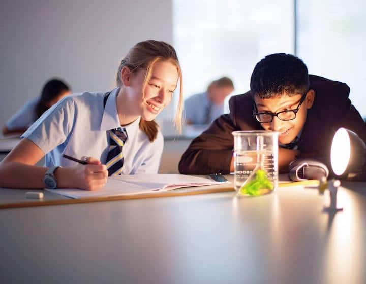 students doing a science experiment at north london collegiate school singapore