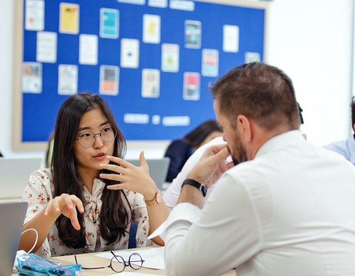 teacher engaging with student at british international school north london collegiate school (singapore)