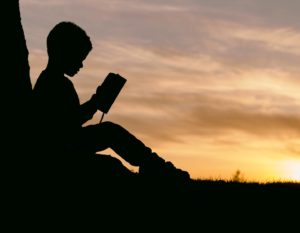 children's book recommendations to understand big feelings a little boy reading a children's book