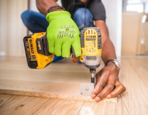 Handyman Singapore - Image Credit: https://www.pexels.com/photo/person-using-dewalt-cordless-impact-driver-on-brown-board-1249611/