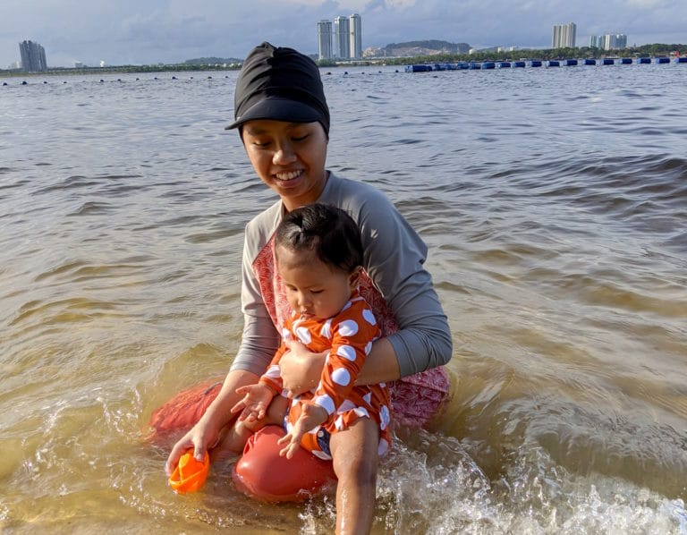 mother daughter beach baby