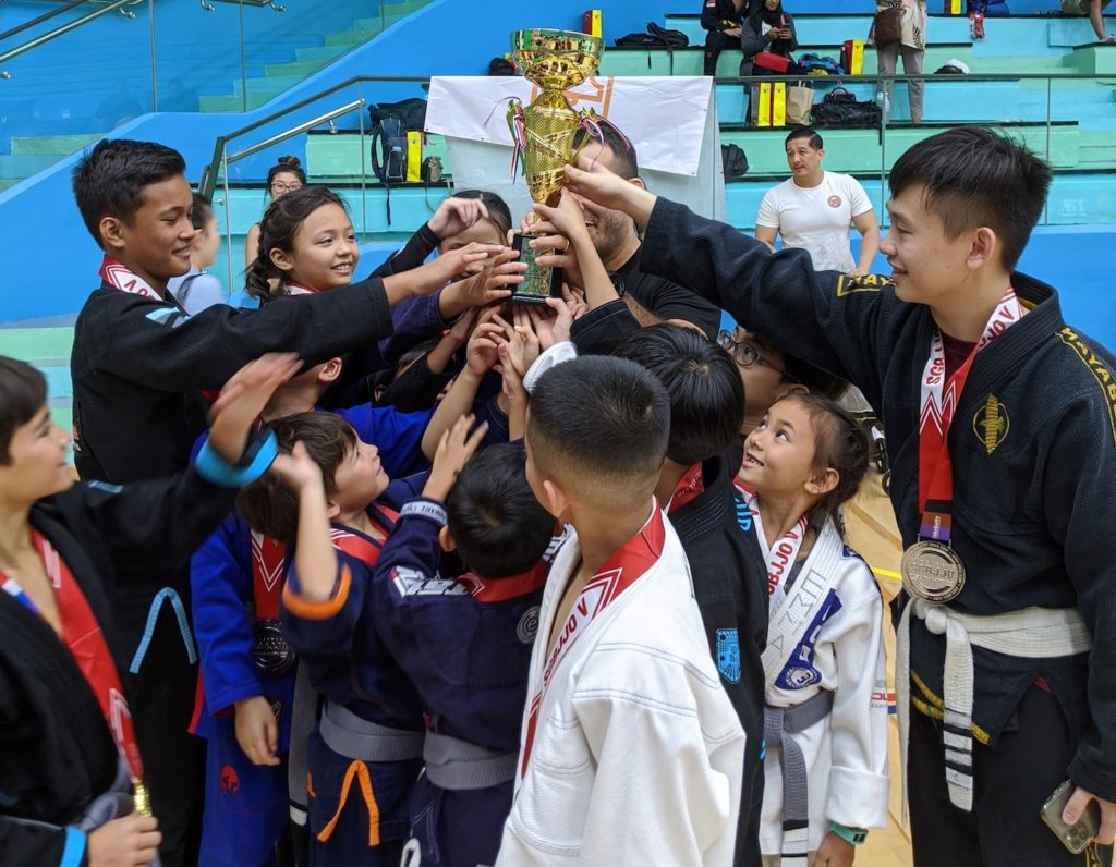 bjj singapore kids huddle trophy cheer