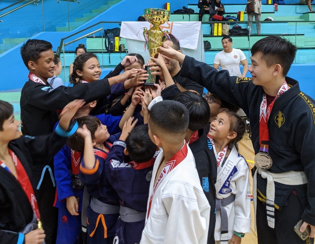 bjj singapore kids huddle trophy cheer