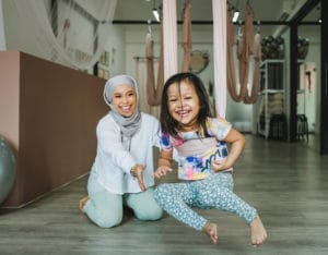 that-mama-nura-ahmad-her-tribe-yoga-studio-daughter-playing-sling-cocoon-min