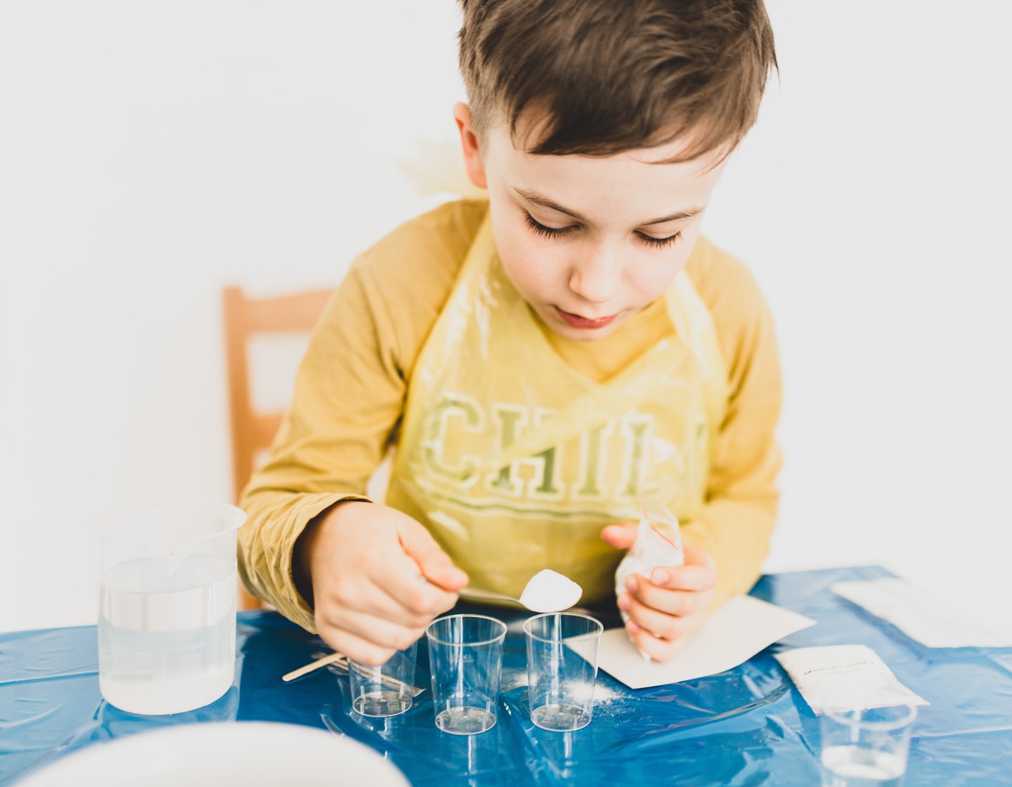 Child playing with science kit