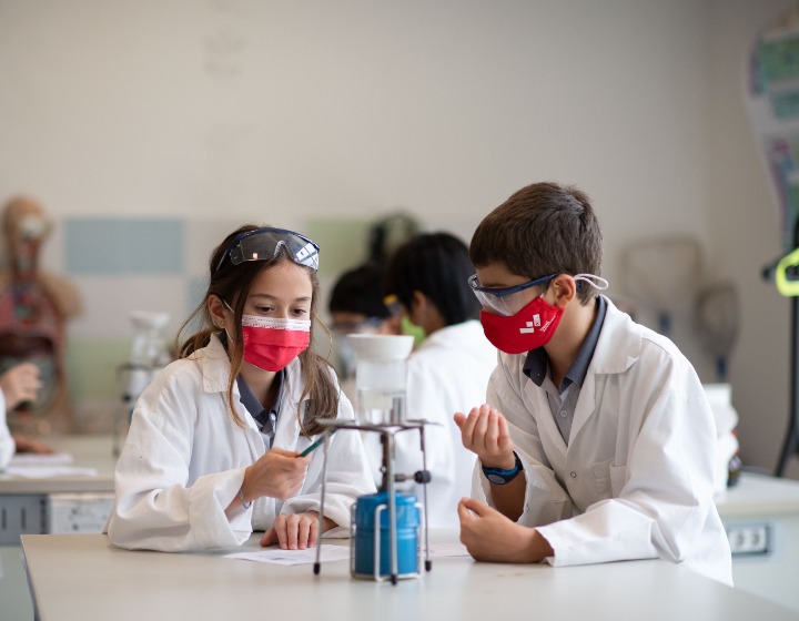 XCL World Academy - students in science lab