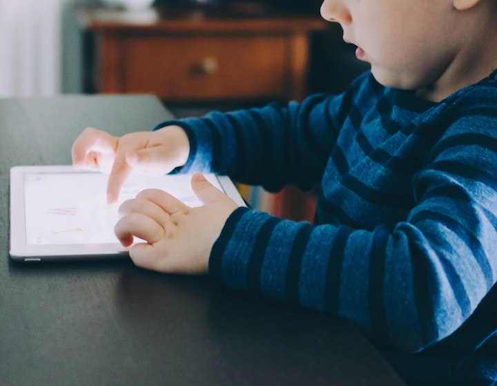 Multitasking in Kids - child using electronic device