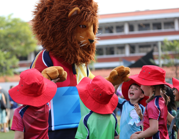 international school singapore - Tanglin Trust School mascot with students