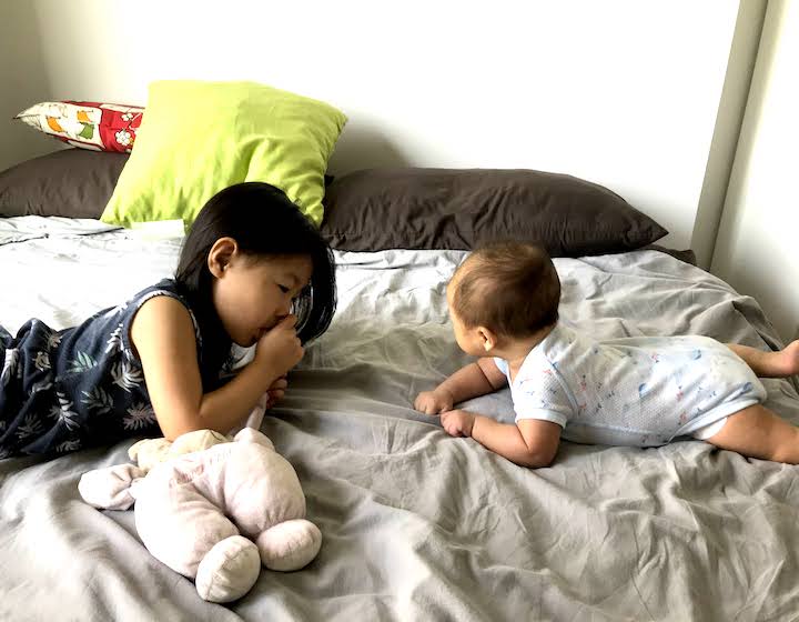 Toddler & Newborn on Bed