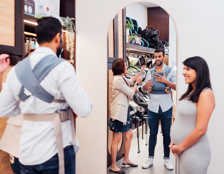 baby stores singapore pramfox strollers father trying baby carrier with pregnant wife